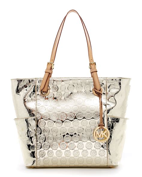 michael kors metallic signature jet set travel tote|Michael Kors airplane bag.